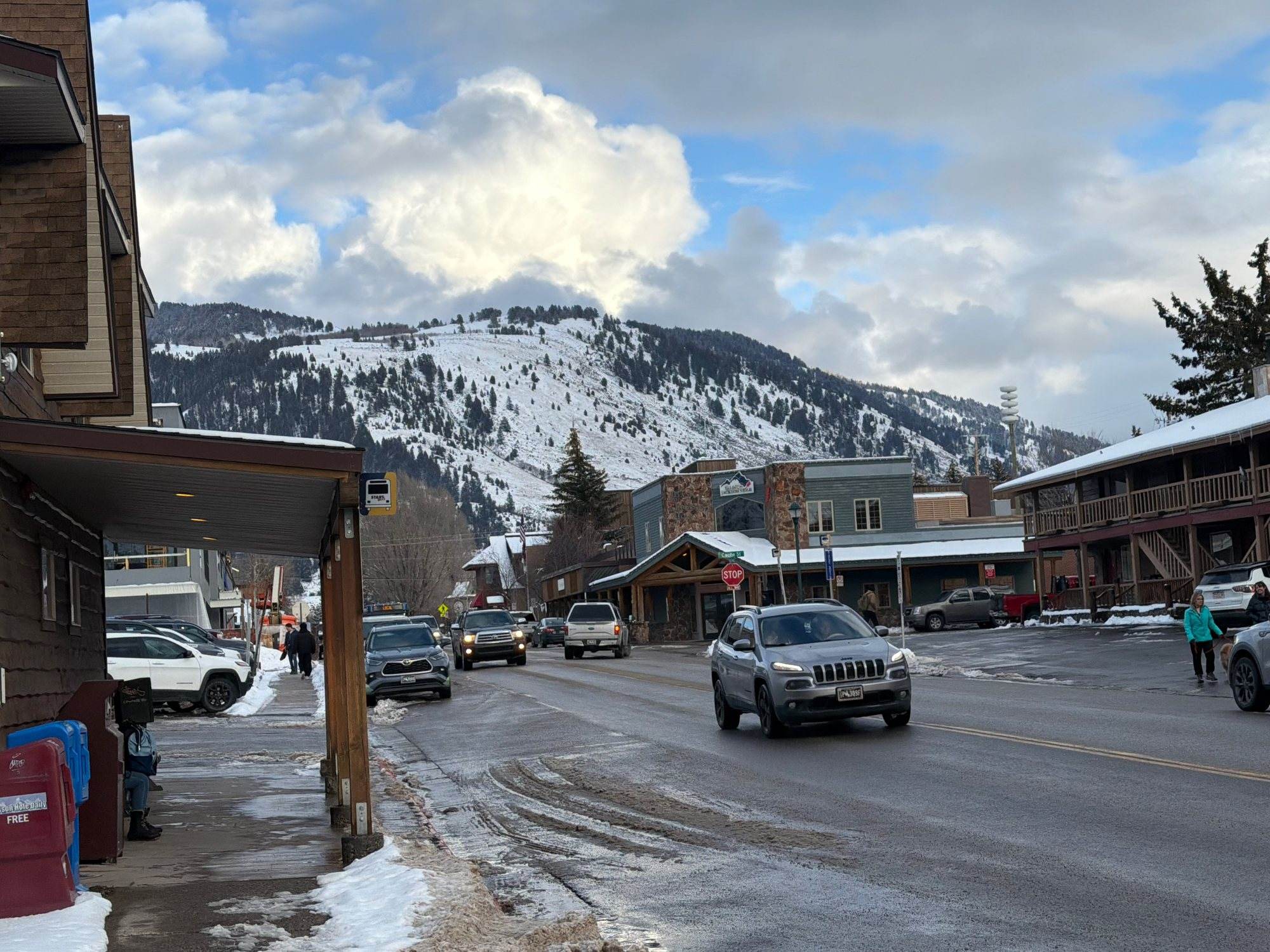 A Jackson street in winter with Snow King behind